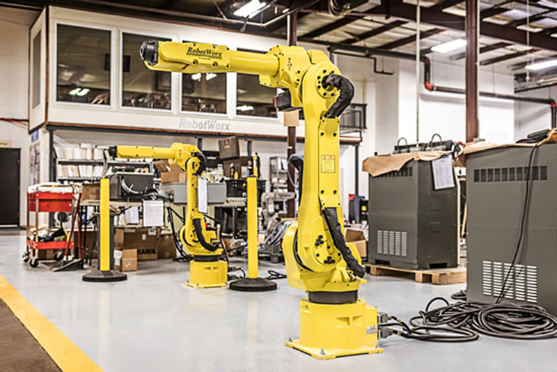 A traditional assembly robot uses a hydraulic robotic arm for industrial applications.